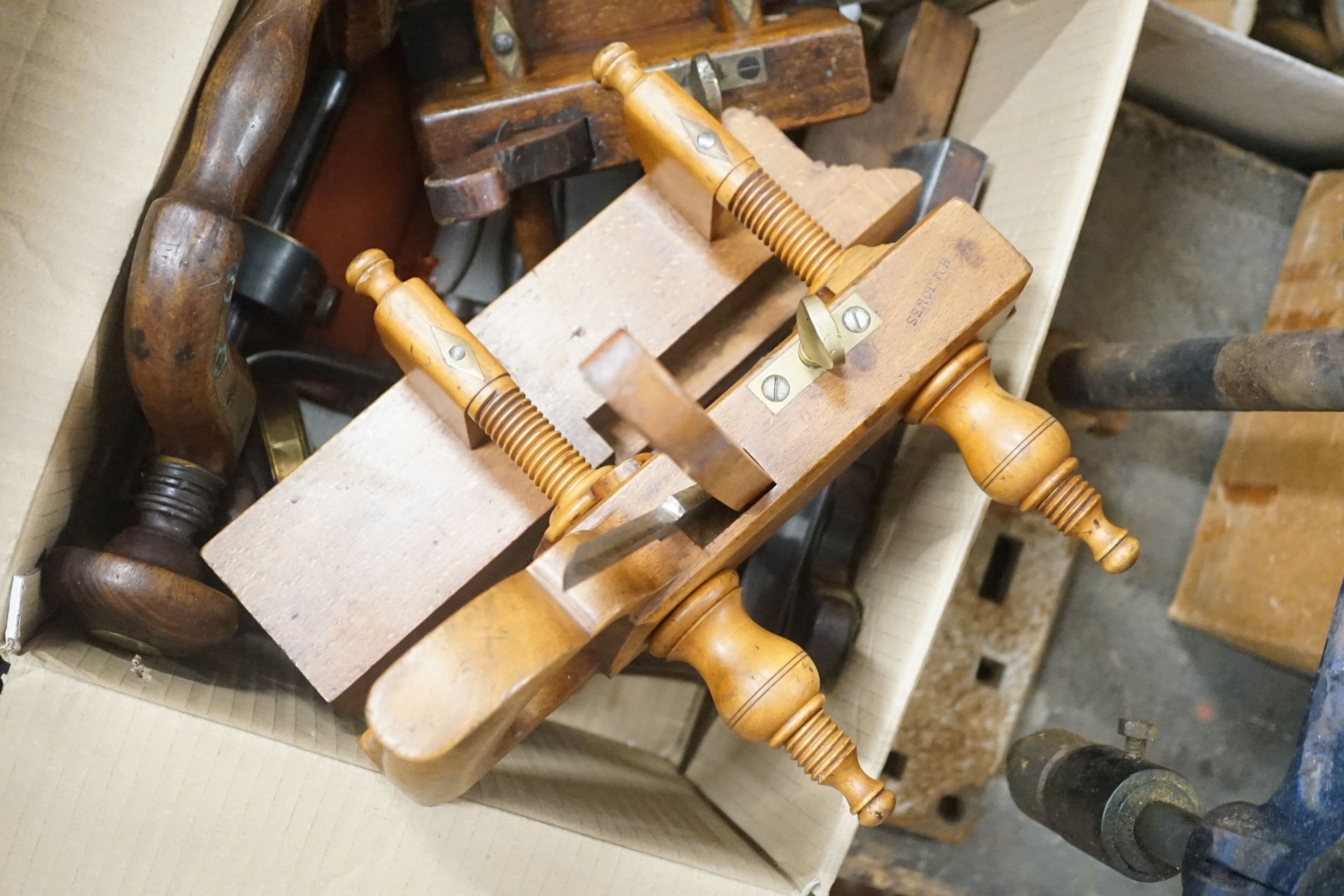 A large quantity of Victorian and later carpentry tools to include assorted steel and brass mounted planes, three Victorian pine trunks etc.